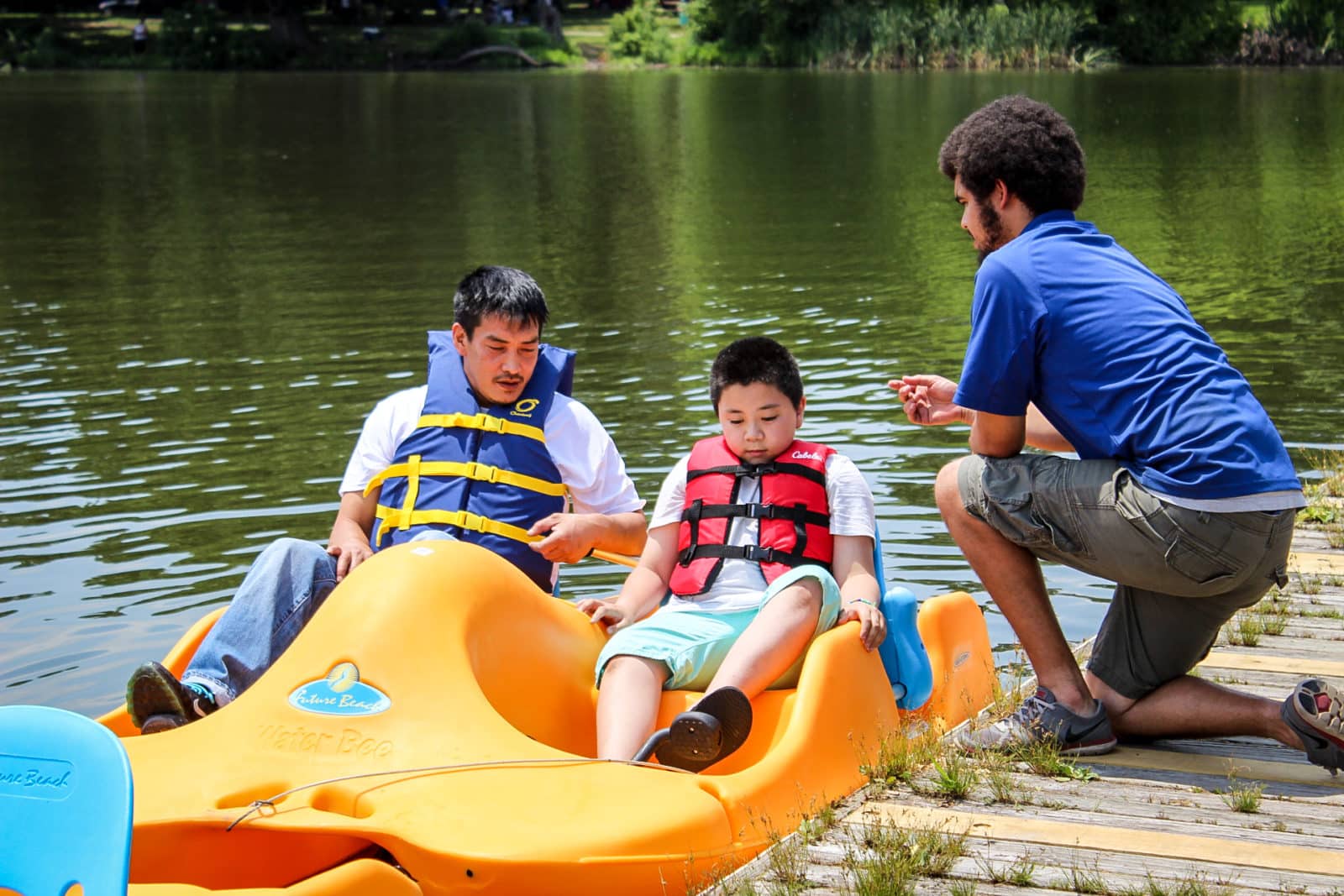 Boys in yellow pedal boat